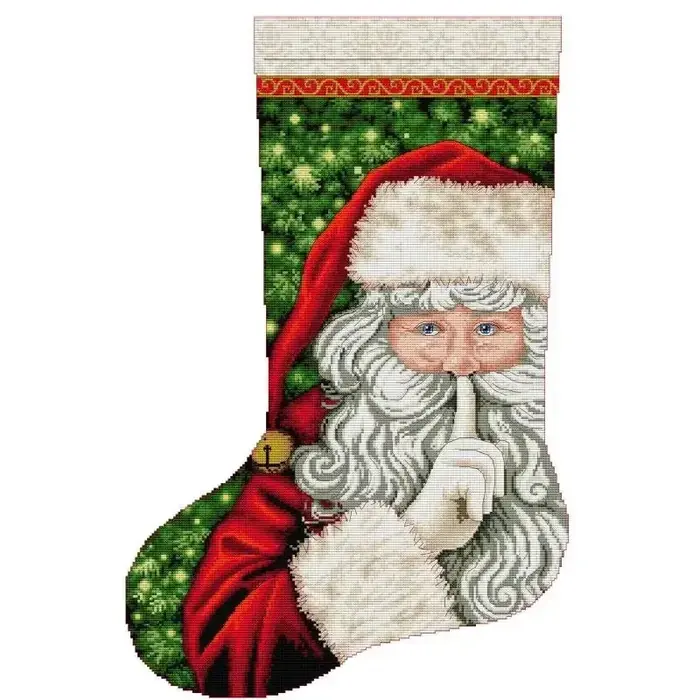 Christmas stocking cross stitch design CC-K13-18: a portrait of Santa holding a finger to his lips beside glowing Christmas trees in red, green and linen tones