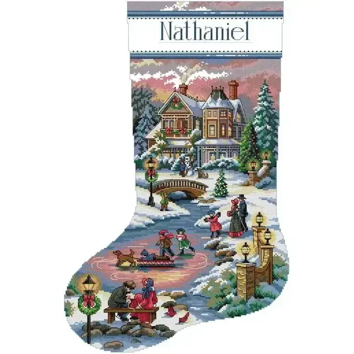 Personalizable Christmas stocking cross stitch design CC-K13-24: a Victorian village at dusk with skaters on a frozen pond and a couple on a bench, with a name band you stitch yourself