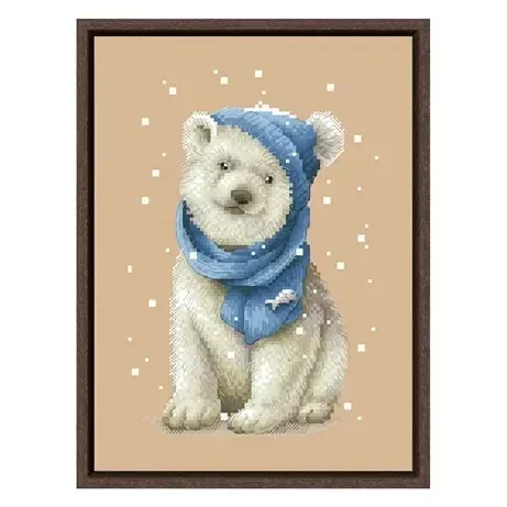 White Bear counted cross stitch design CC-K6-02: a polar bear cub sitting in a denim-blue beanie and scarf decorated with a small fish