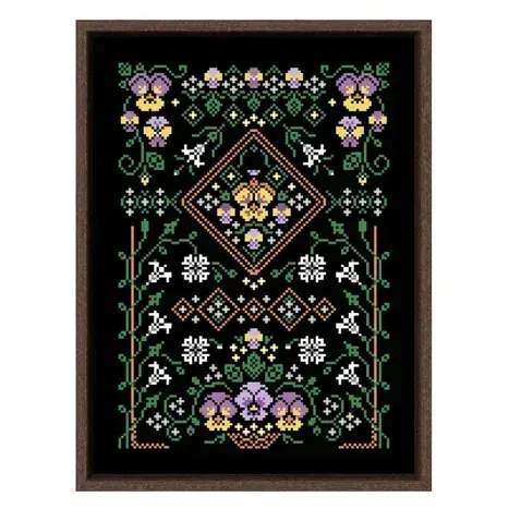 Pansy sampler cross stitch design CC-K8-01: purple and yellow pansies around an orange diamond medallion on black fabric