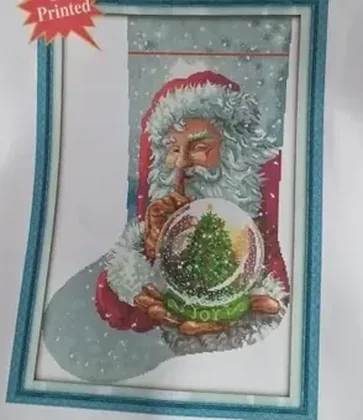 Buyer photo of the Joy Snow Globe stocking kit CC-K13-20: the HD printed stocking panel showing a winking Santa holding a snow globe with a Christmas tree inside
